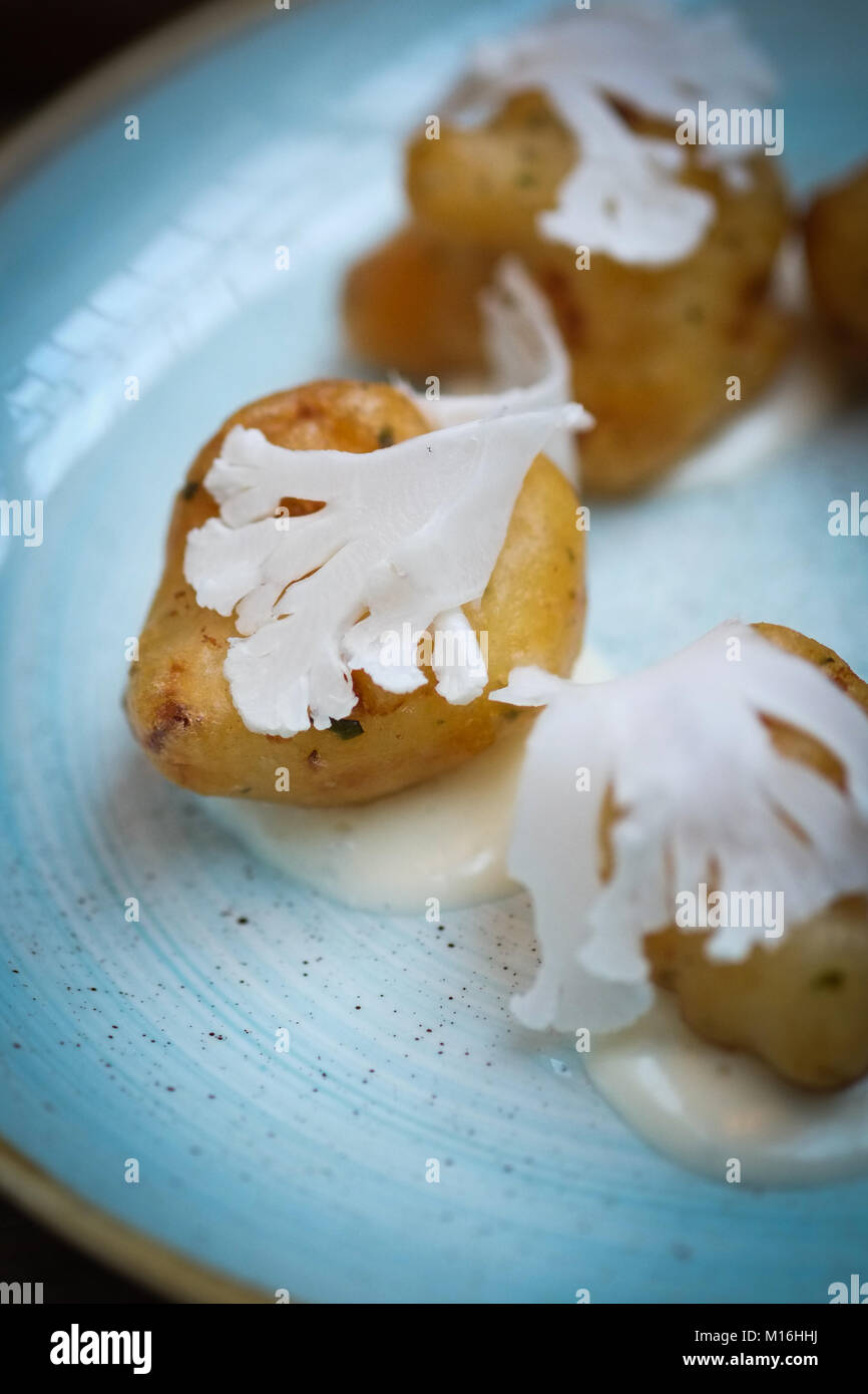 Cauliflower tempura with pickled and pureed cauliflower. Light, modern