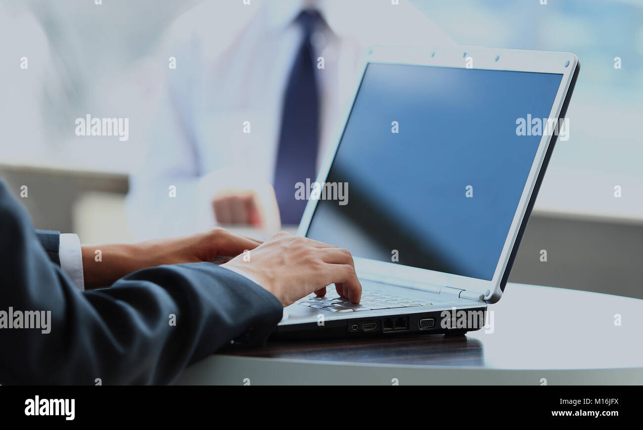 Person Typing on a modern laptop in an office Stock Photo - Alamy
