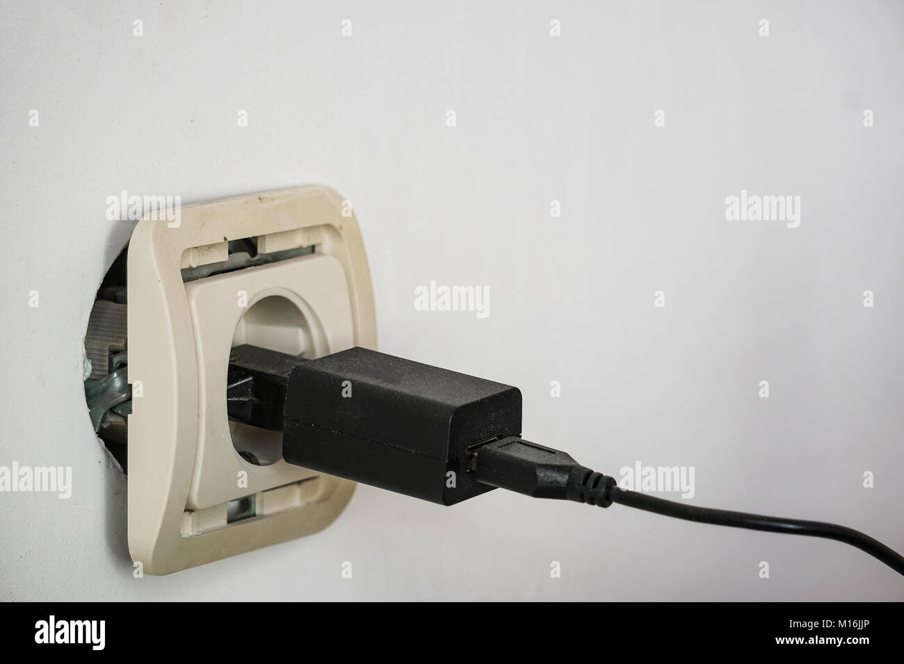 Electrical socket outlet falling out of wall Stock Photo Alamy