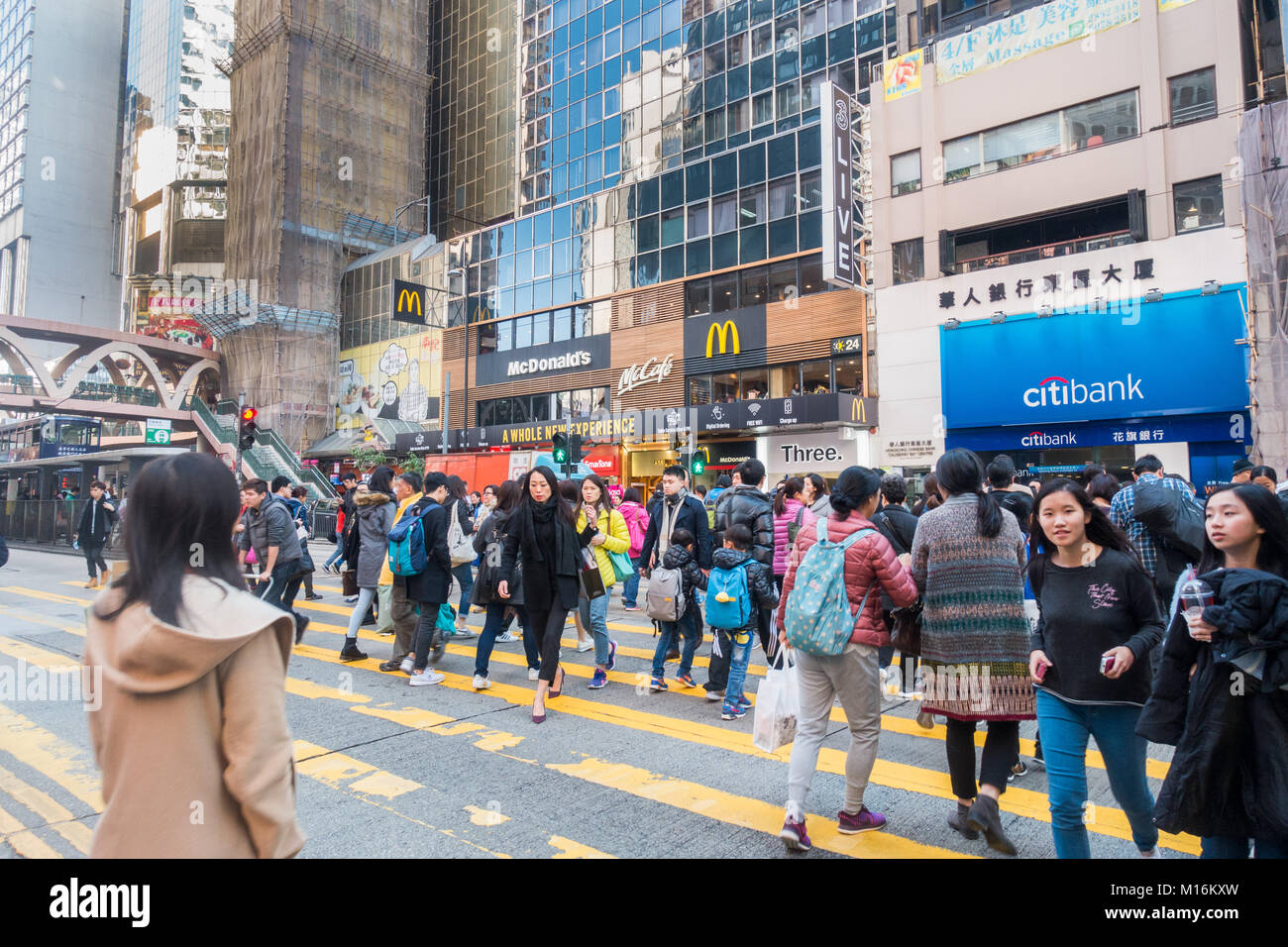 Hong Kong busy street scene with people crossing Stock Photo - Alamy
