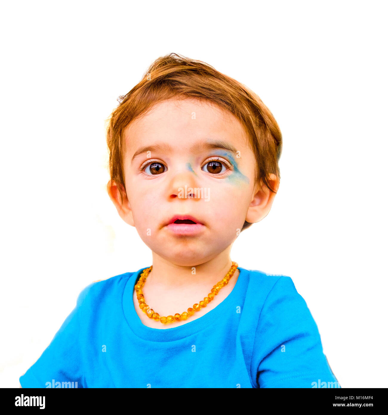 innocent baby face isolated painted blue face expression newborn Stock Photo