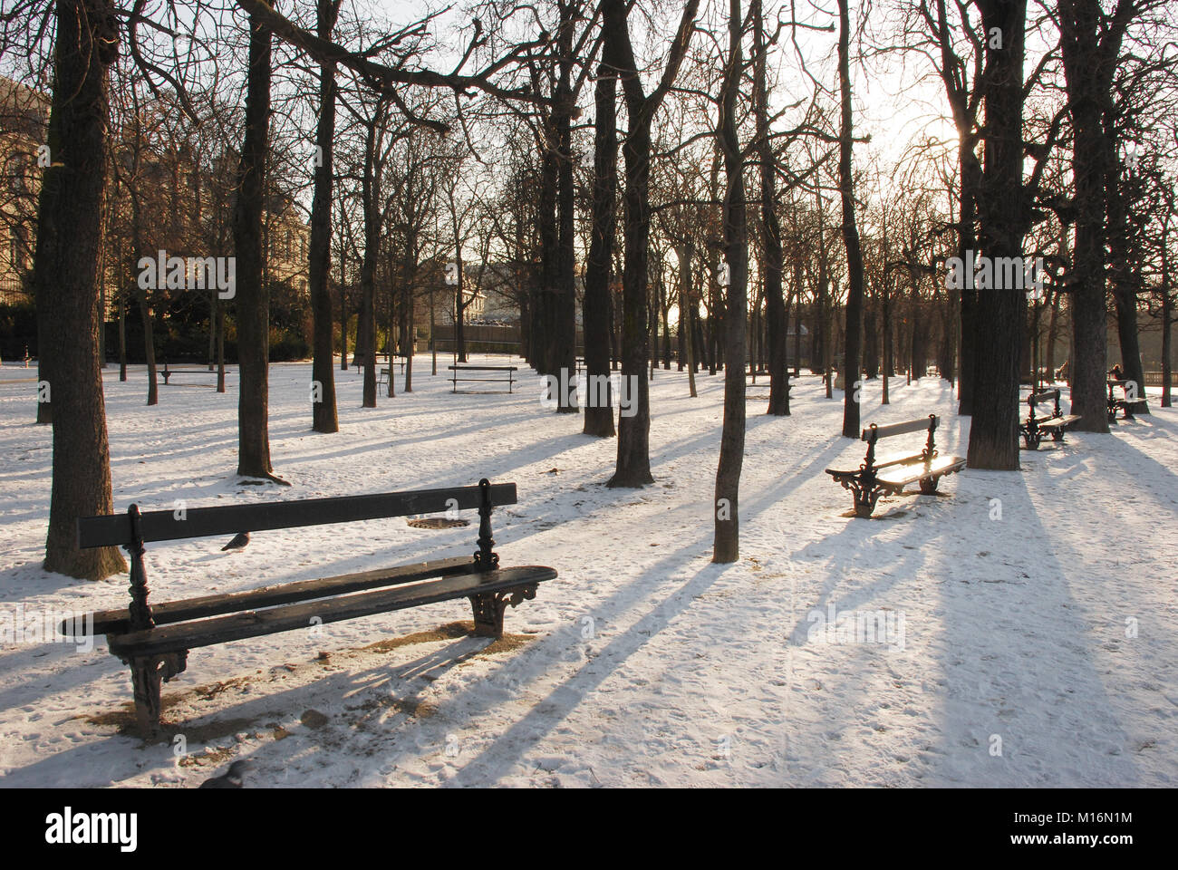 Snow Scene in Paris Park with Park Benches Stock Photo