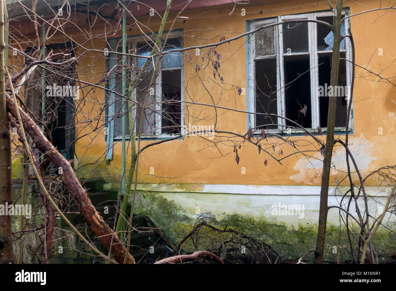 Exterior of an abandoned building broken windows Stock Photo - Alamy