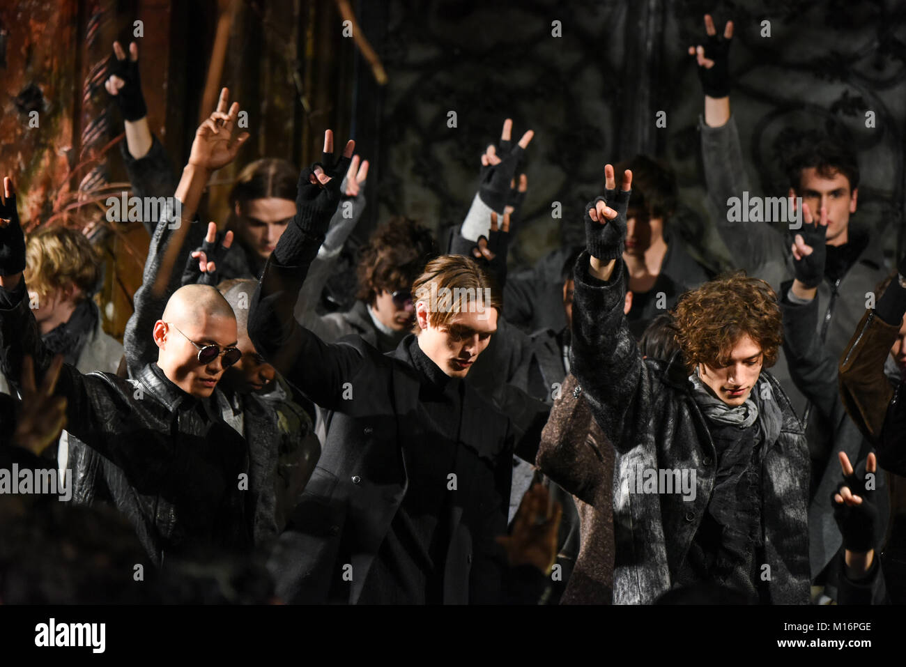 NEW YORK, NY - JANUARY 26: Designer and Models poses the runway wearing John Varvatos Fall/Winter 2018 showing peace signs at the Angel Orensanz Found Stock Photo