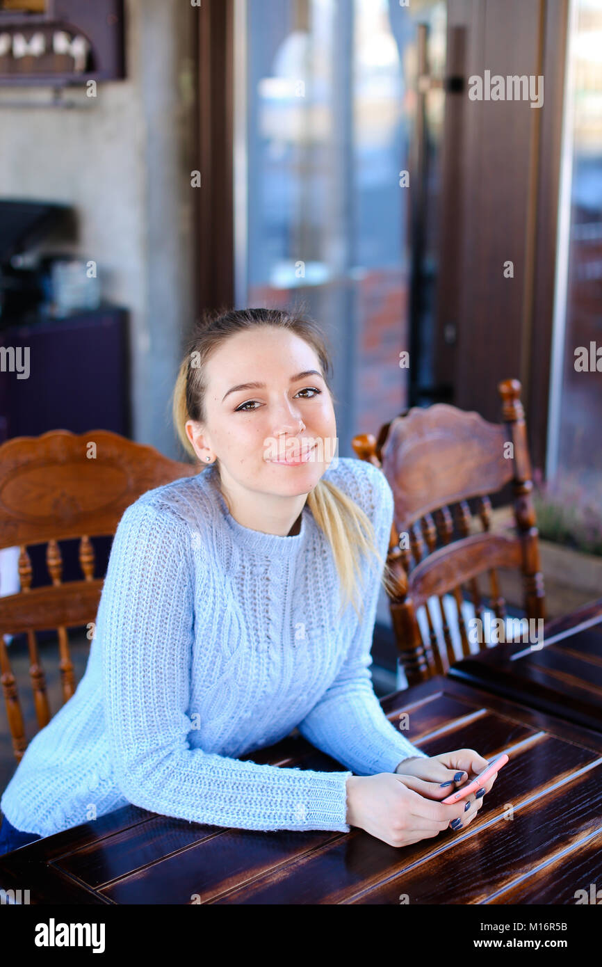 Model waiting photographer for photoshoot in cafe Stock Photo - Alamy