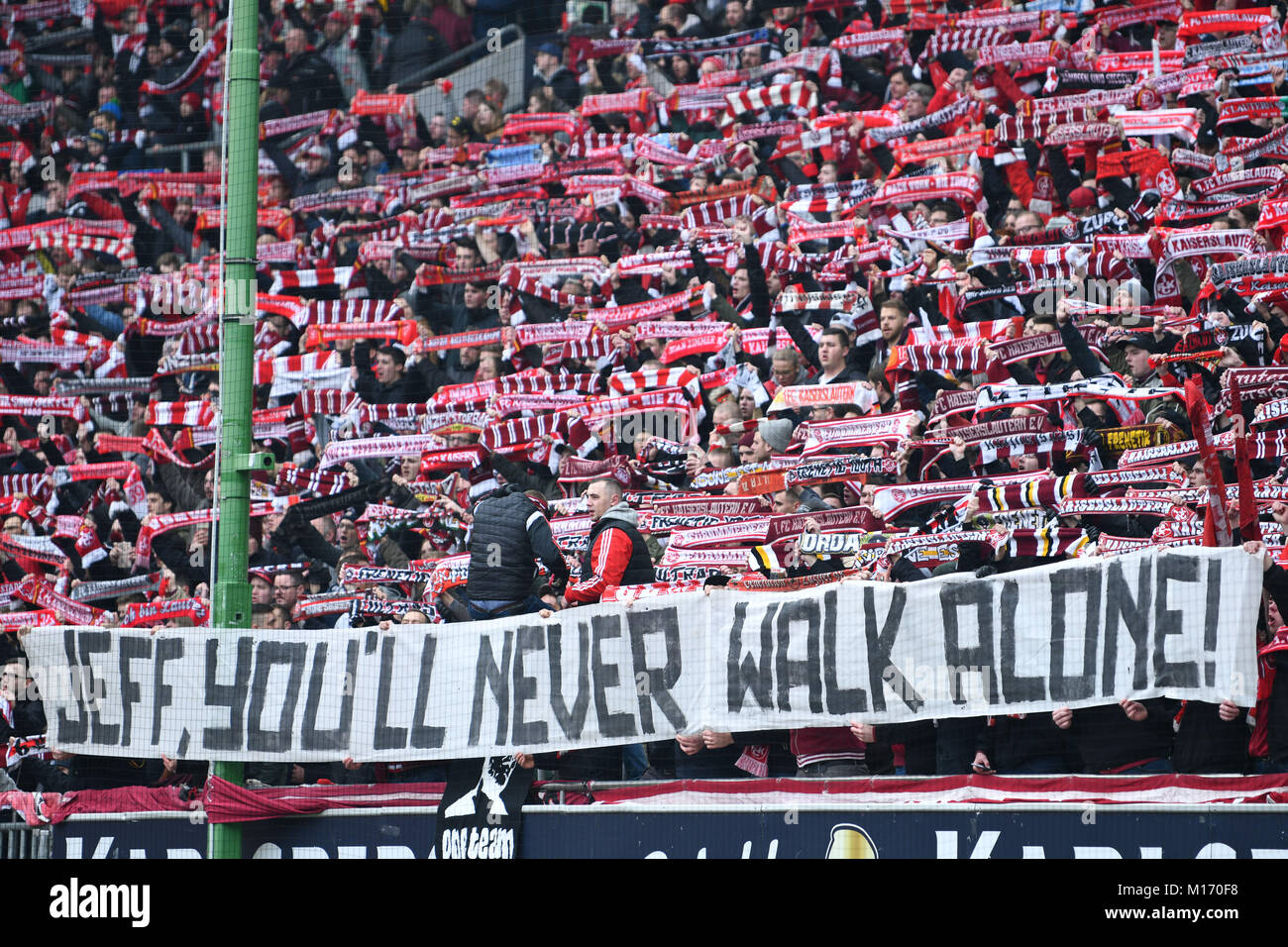 Kaiserslautern fans hold up a banner that reads 'Jeff, you'll never walk alone!' for head coach Jeff Strasser during the German 2nd Bundesliga football match between 1. FC Kaiserslautern and Fortuna Duesseldorf at the Fritz-Walter-Stadion in Kaiserslautern, Germany, 27 Janaury 2018. (EMBARGO CONDITIONS - ATTENTION: Due to the accreditation guidelines, the DFL only permits the publication and utilisation of up to 15 pictures per match on the internet and in online media during the match.) Photo: Uwe Anspach/dpa Stock Photo