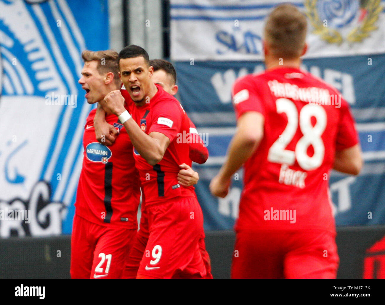 Munich's goalkeeper Stefan Ortega Moreno (R) catches the penalty shot by  Andreas Geipl of Regensburg (2-R) during the 2. Bundesliga relegation match  between Jahn Regensburg and TSV 1860 Munich at the Continental