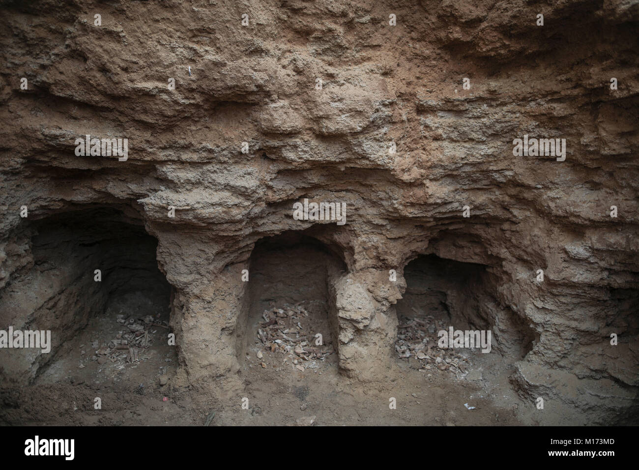 Beit Hanoun, Northern Gaza City. 27th Jan, 2018. Three of nine burial holes with bones pictured in a tomb discovered by Abdelkarim al-Kafarna, in his backyard in Beit Hanoun, Northern Gaza City, 27 January 2018. Archaeologists in Gaza say they believe it is about 2,000-year-old, dating back to the Roman era, where Gaza was part of the far-flung Roman Empire. Further tests are to be carried out to determine THE exact age. Credit: Wissam Nassar/dpa/Alamy Live News Stock Photo