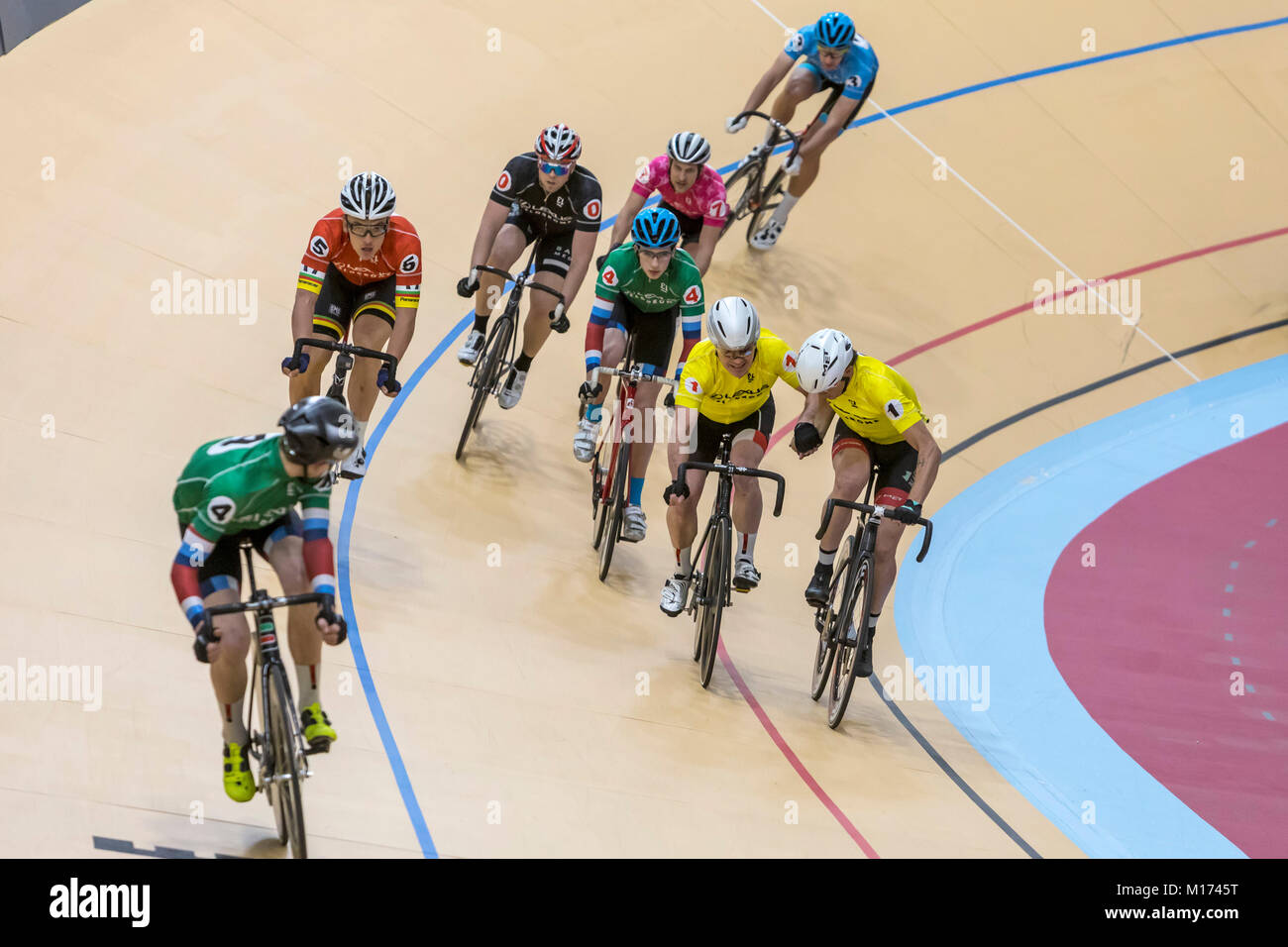 Detroit, Michigan USA - 26 January 2018 - A series of bicycle races celebrated the grand opening of the Lexus Velodrome, one of only three indoor veleromes in the United States. Teammates in yellow jerseys exchange places in a 'Madison' relay race. Credit: Jim West/Alamy Live News Stock Photo