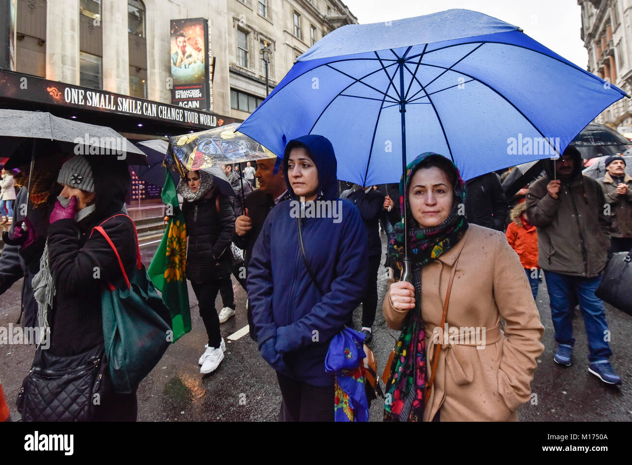 London, UK.  27 January 2018.  Protesters walk down Whitehall as thousands of Kurdish people march from the BBC's Headquarters in Portland Place to Downing Street to protest against Turkey's military invasion of the city of Afrin in Northern Syria, a predominantly Kurdish city.  Protesters called for the British public to show solidarity with the people of Afrin and for the UK to demand that Turkey pull back its forces. Credit: Stephen Chung / Alamy Live News Stock Photo