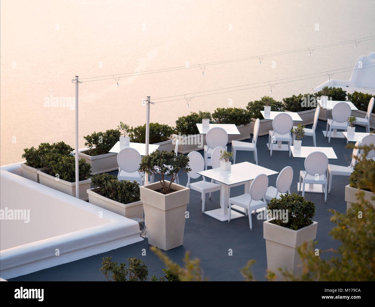 Tables with chairs with nice view of Santorini seascape in cyclades ...