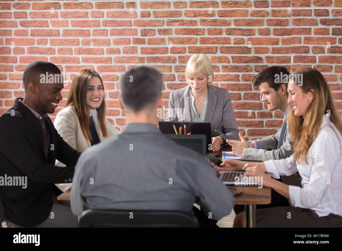 Diverse Group Of Businesspeople At Workplace In Office Stock Photo - Alamy
