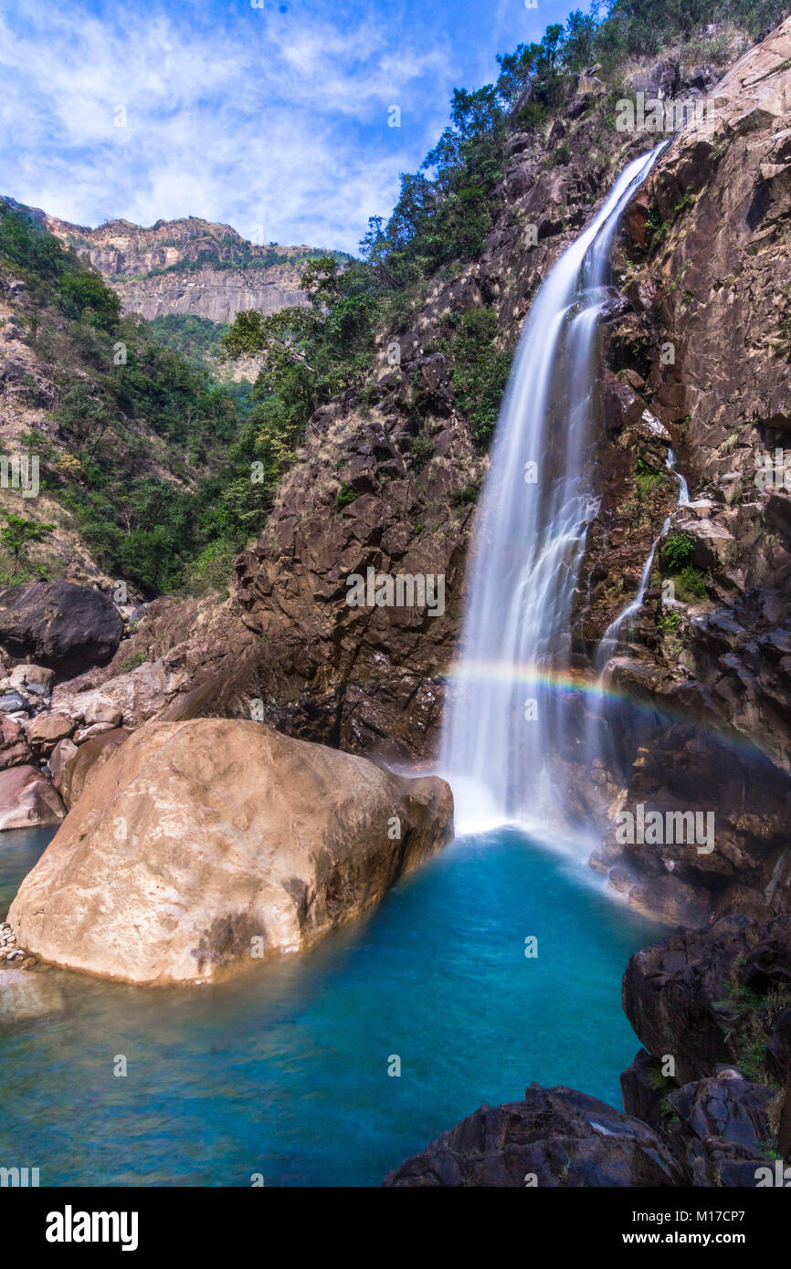 The rainbow waterfall of Nongriat in Meghalaya with that clear blue water is a wonderful pool to swim. Stock Photo