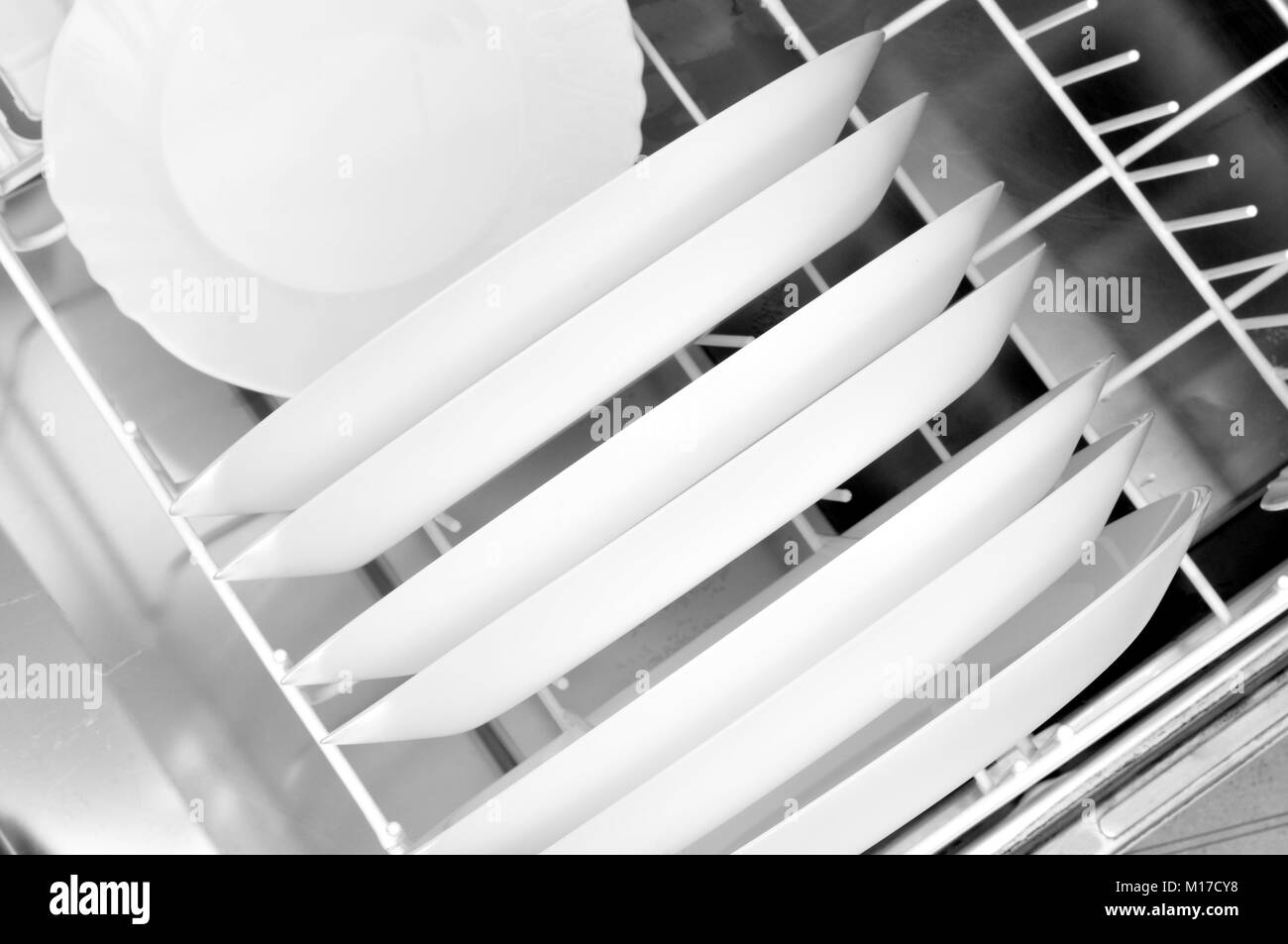clean dishes in the dishwasher basket, top view Stock Photo Alamy