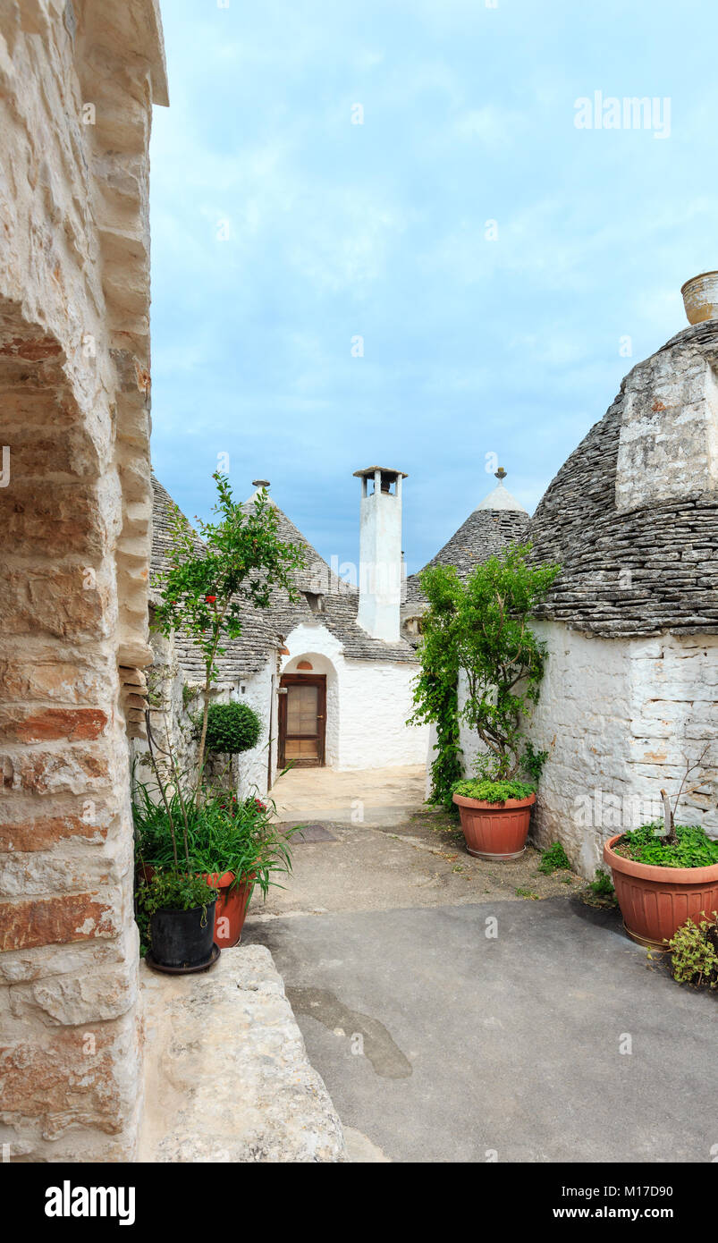 Trulli houses in main touristic district of Alberobello beautiful old historic town, Apulia region, Southern Italy Stock Photo