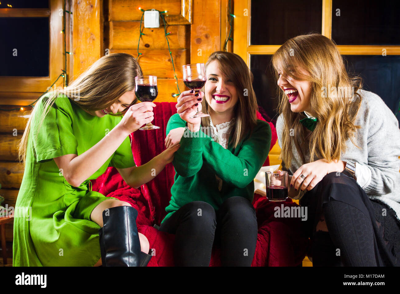 Girls celebrating St Patrick’s day on a home party wearing green outfits Stock Photo