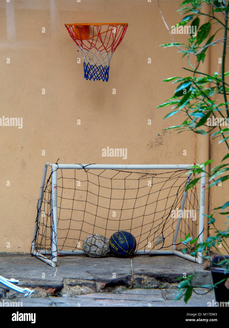 Basketball hoop above a soccer goal Stock Photo Alamy