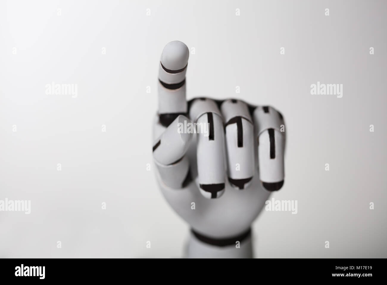 Close-up Of Robotic Hand Touching Transparent Screen Stock Photo