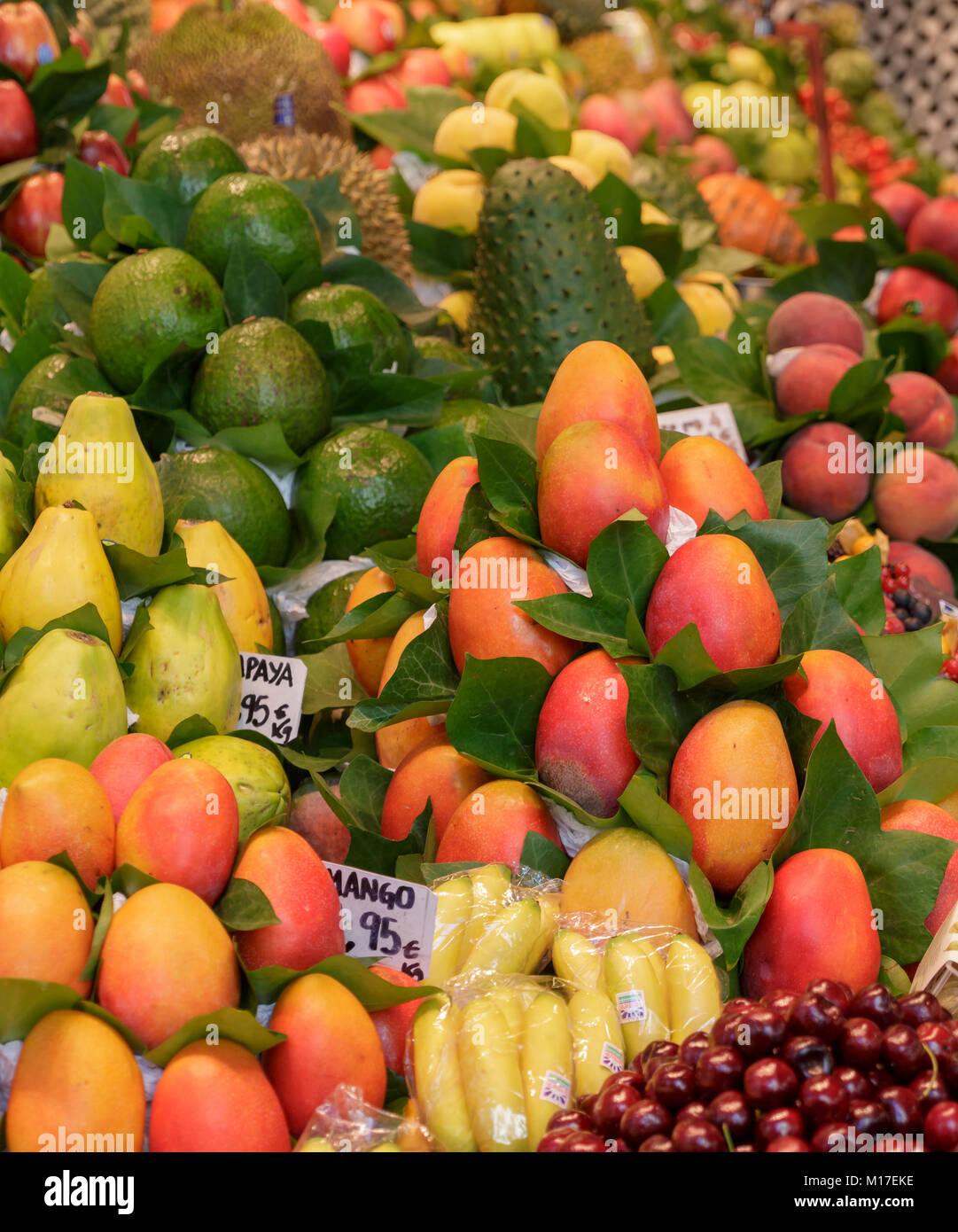 Mangoes Papayas and Limes in a Spanish Fruit Market Stock Photo Alamy