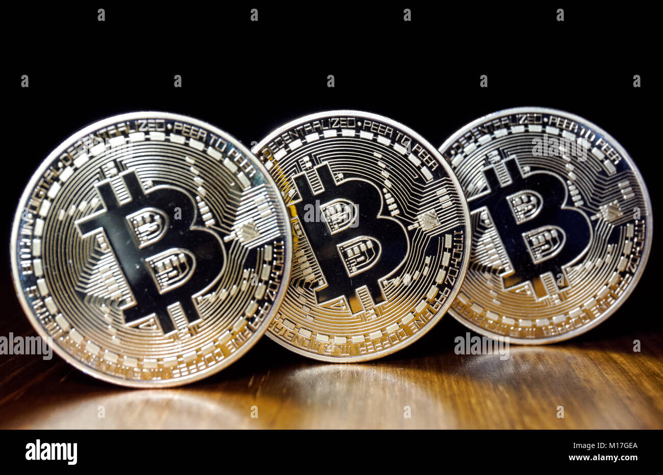 Bitcoin cryptocurrency coins on black background Stock Photo