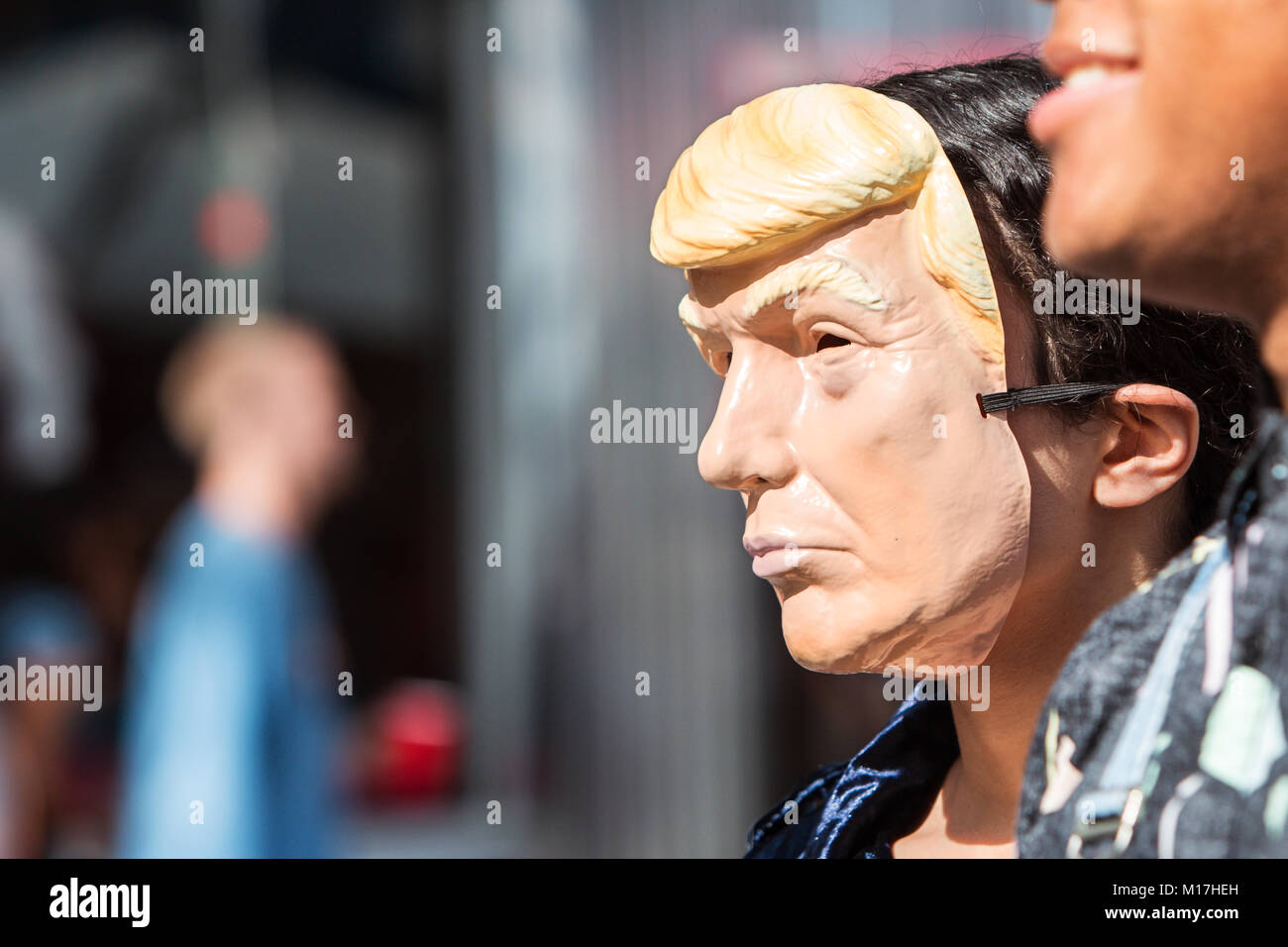 Atlanta, GA, USA - October 21, 2017:  A person wears a Donald Trump mask at the Little Five Points Halloween Parade on October 21, 2017 in Atlanta. Stock Photo