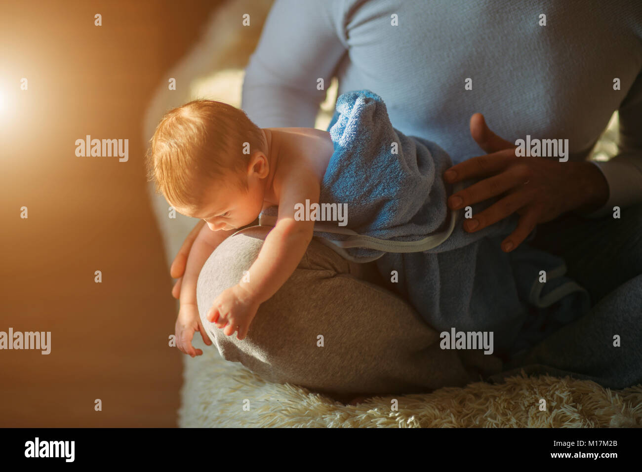 man drying his baby after showering and bathing Stock Photo Alamy