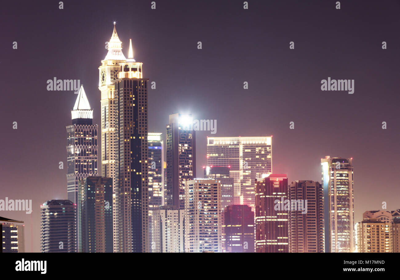 Illuminated Dubai Skyline At Night Against Sky Stock Photo - Alamy