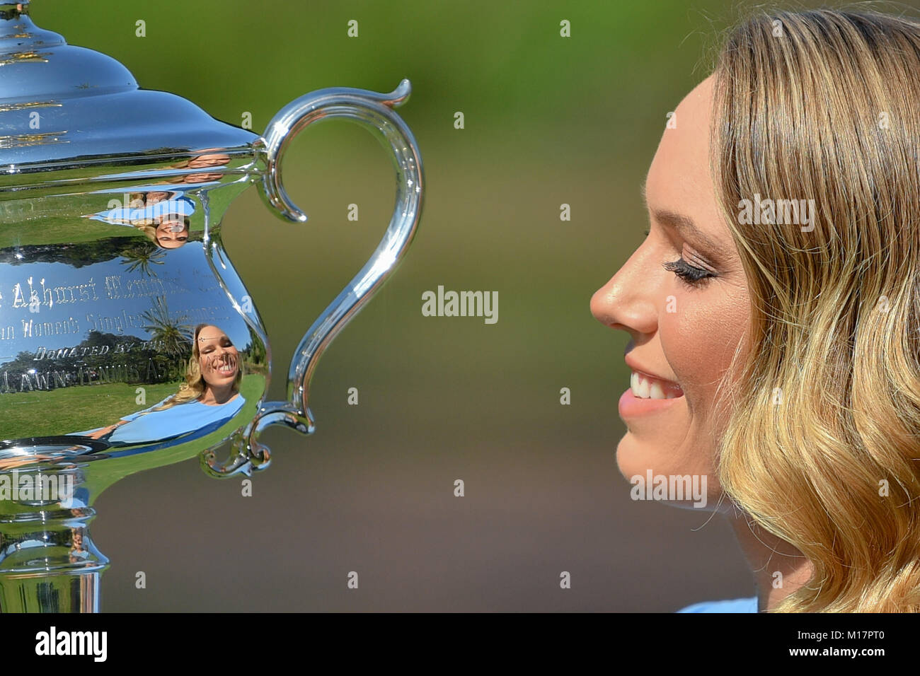 Melbourne, Australia. 28th Jan, 2018. The 2018 Australian Open Women's Champion Caroline Wozniacki of Denmark kisses her trophy at the Botanical Gardens in Melbourne, Australia. Sydney Low/Cal Sport Media/Alamy Live News Stock Photo