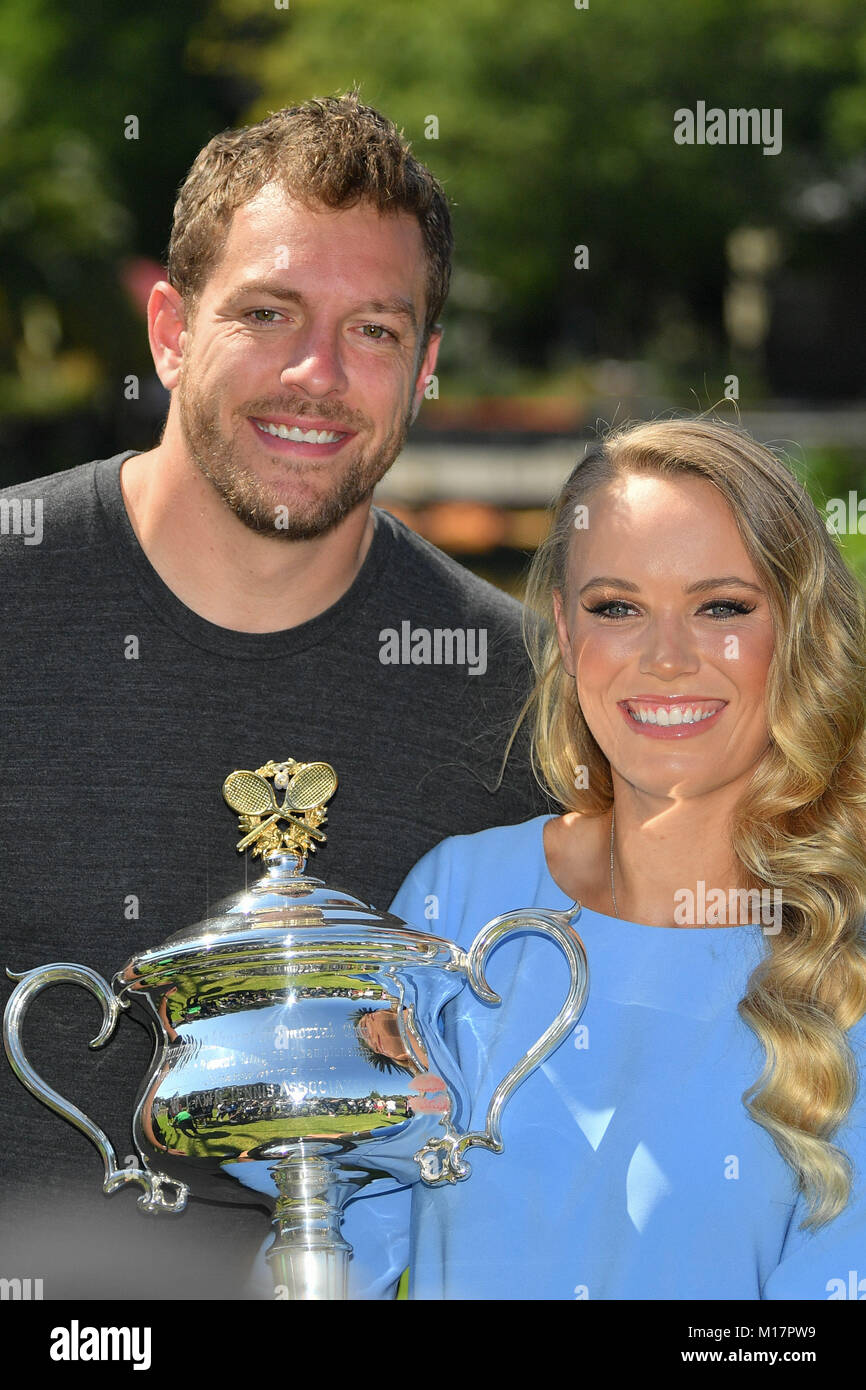 Melbourne, Australia. 28th Jan, 2018. The 2018 Australian Open Women's Champion Caroline Wozniacki of Denmark and her fiancé David Lee pose for photographs with her trophy at the Botanical Gardens in Melbourne, Australia. Sydney Low/Cal Sport Media/Alamy Live News Stock Photo