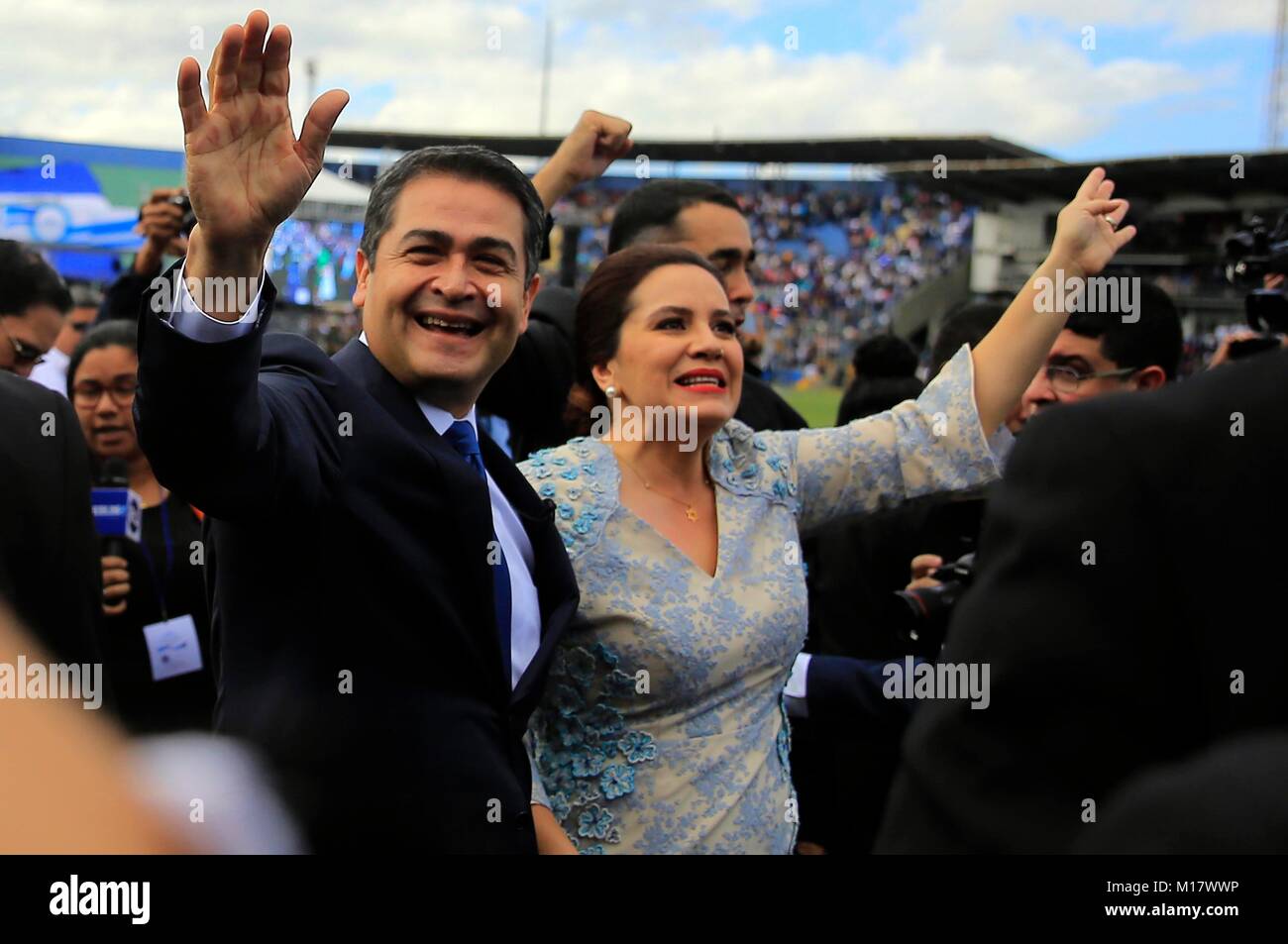 Tegucigalpa, Honduras. 27th Jan, 2018. Honduran President Juan Orlando Hernandez (L) and his wife Ana Garcia (R) take part in a ceremony of inauguration held in the National Stadium in Tegucigalpa, capital of Honduras, on Jan. 27, 2018. Honduran President Juan Orlando Hernandez promised Saturday to bring about significant reforms in various fields to resolve the country's ongoing political crisis. Credit: Rafael Ochoa/Xinhua/Alamy Live News Stock Photo