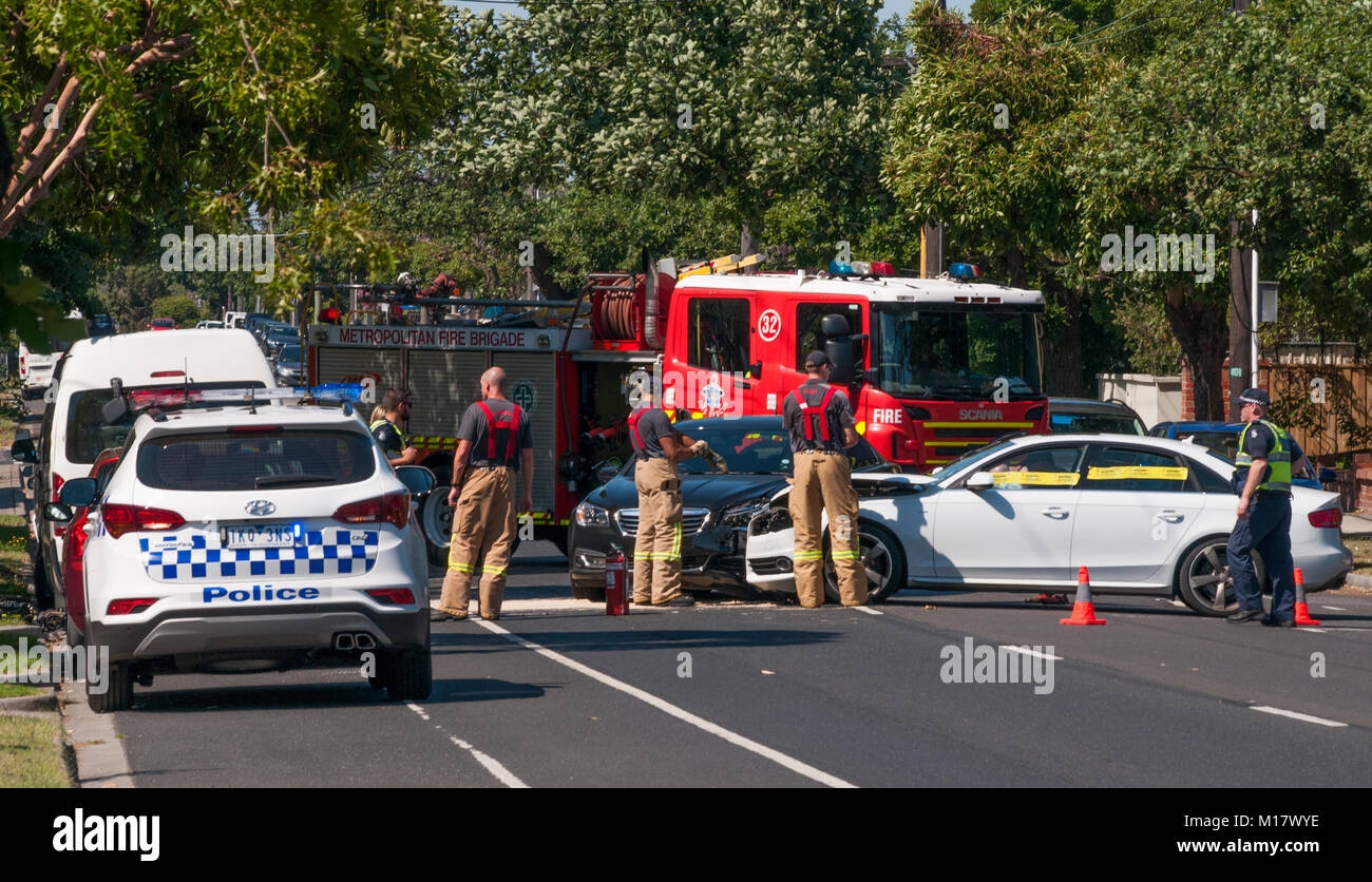 Melbourne, Australia. 28th January 2018. Police and fire brigade personnel clear the scene of a traffic accident in Kooyong Road, South Caulfield. Credit: Philip Game/Alamy Live News Stock Photo