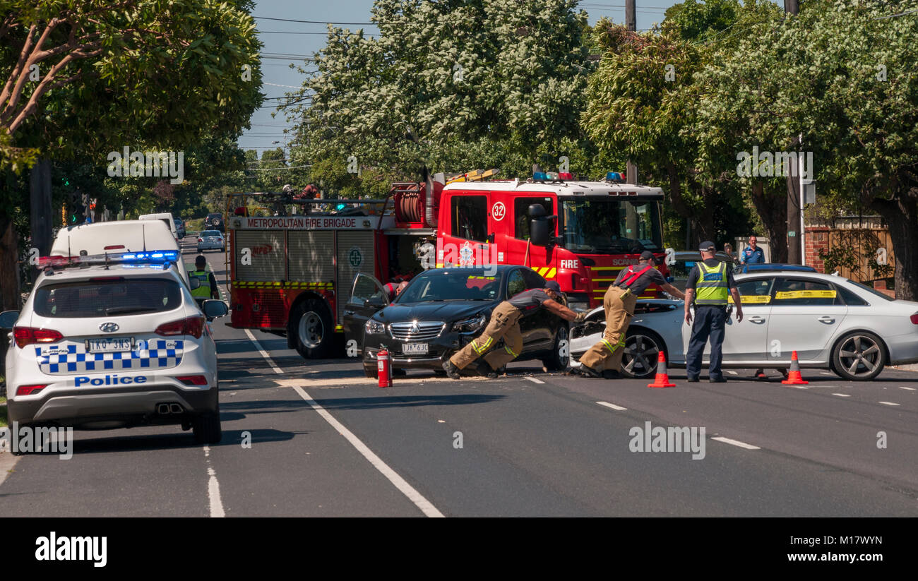 Melbourne, Australia. 28th January 2018. Police and fire brigade personnel clear the scene of a traffic accident in Kooyong Road, South Caulfield. Credit: Philip Game/Alamy Live News Stock Photo