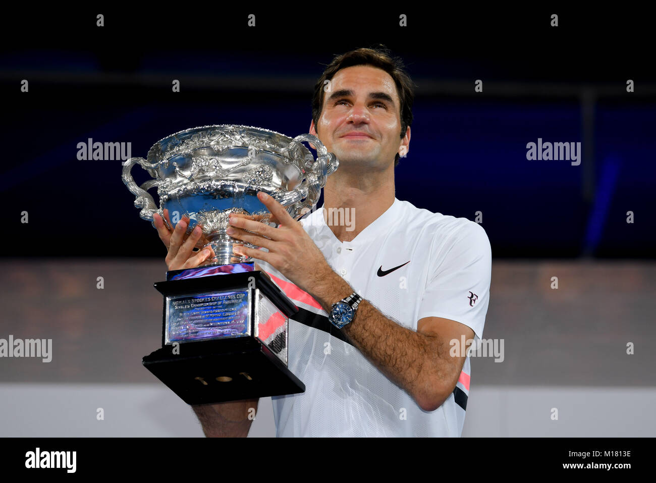 Melbourne, Australia. 28th Jan, 2018. Number two seed Roger Federer of Switzerland poses for photographs with the trophy after winning the Men's Final against number six seed Marin Cilic of Croatia on day fourteen of the 2018 Australian Open Grand Slam tennis tournament in Melbourne, Australia. Federer won 3 sets to 2. Sydney Low/Cal Sport Media/Alamy Live News Stock Photo