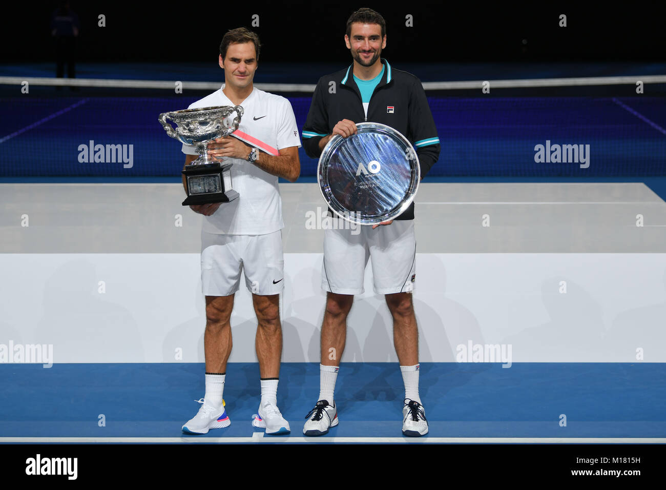 Melbourne, Australia. 28th Jan, 2018. Number two seed Roger Federer of Switzerland and number six seed Marin Cilic of Croatia pose for photographs after Federer won the Men's Final against on day fourteen of the 2018 Australian Open Grand Slam tennis tournament in Melbourne, Australia. Federer won 3 sets to 2. Sydney Low/Cal Sport Media/Alamy Live News Stock Photo