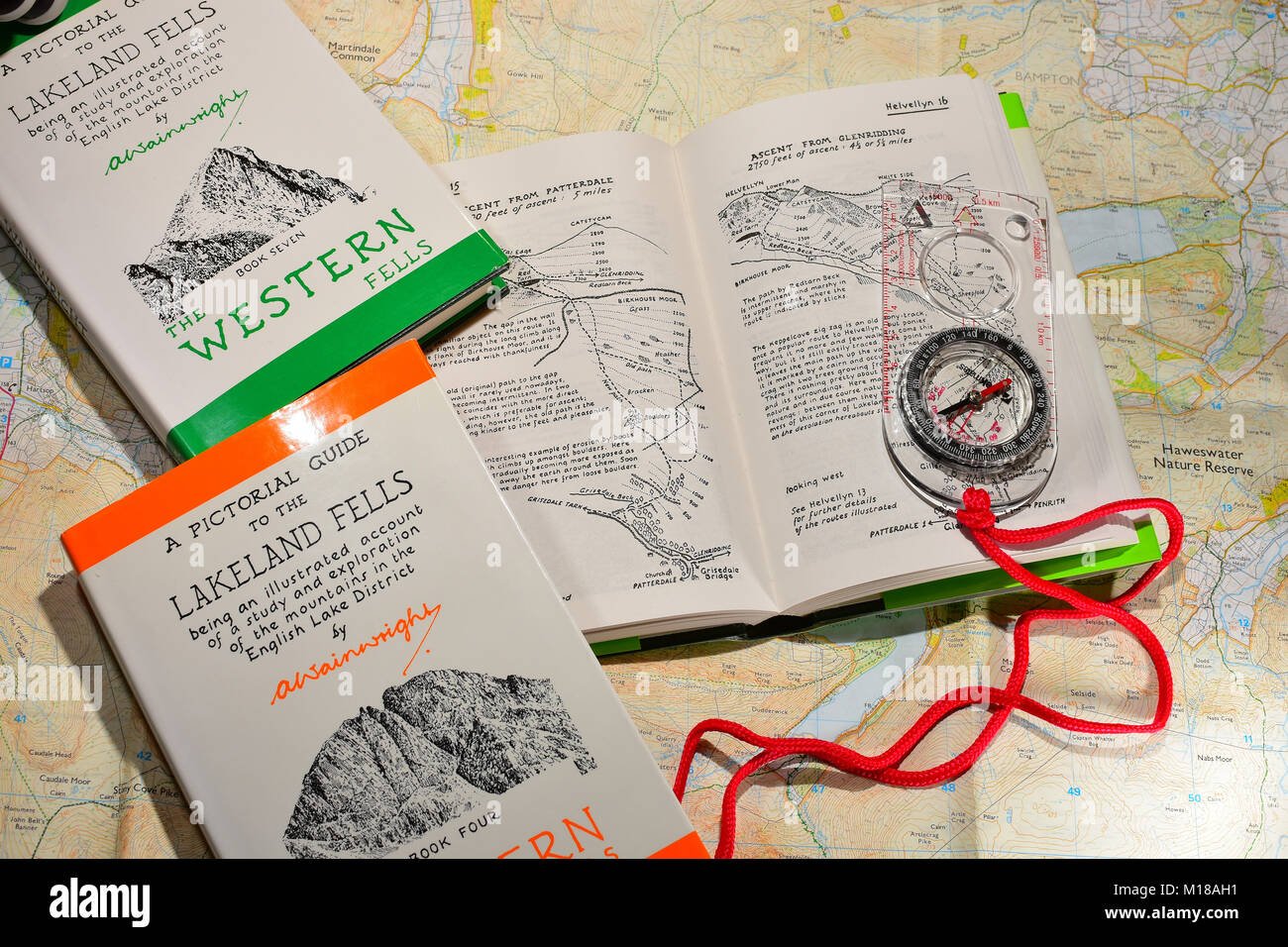 Alfred Wainwright books with compass and OS maps Stock Photo
