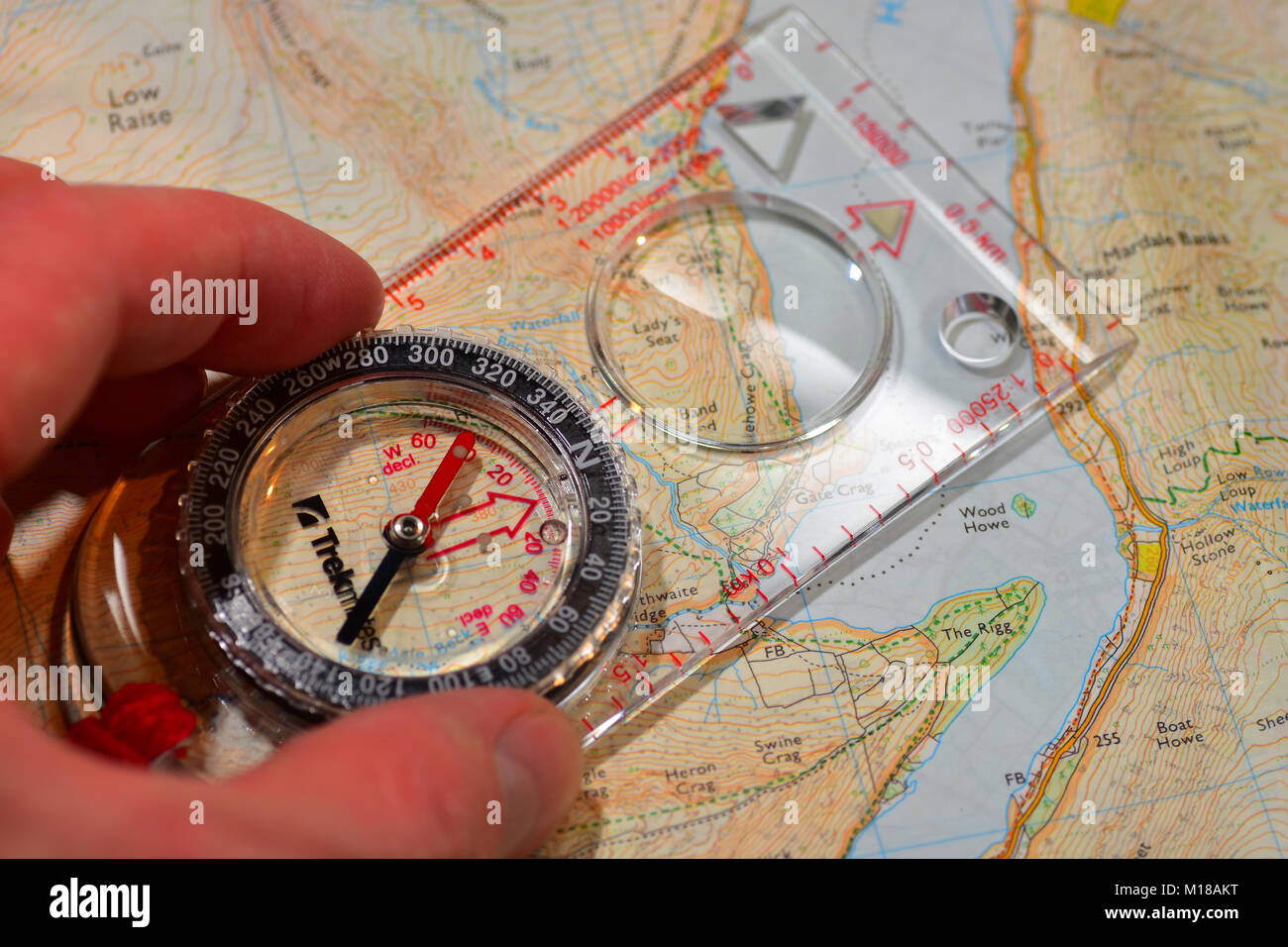 Map reading Compass and Ordinance Survey Map Stock Photo