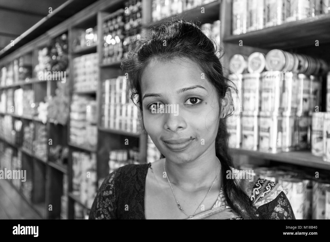 KANDY, SRI LANKA – February 13, 2017 : Portrait of a saleswomen in a tea factory (monochrome) Stock Photo