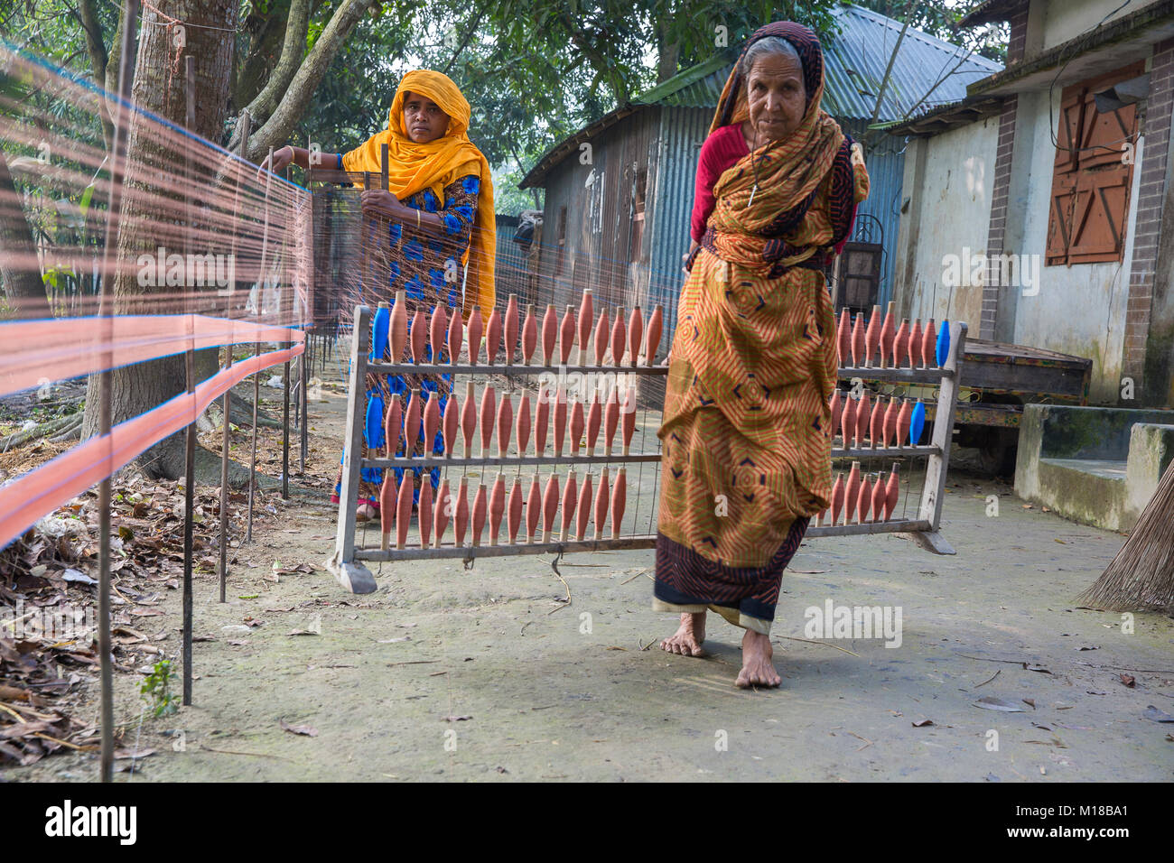Bangladesh – December 18, 2017: An village old lady and other weaver ...