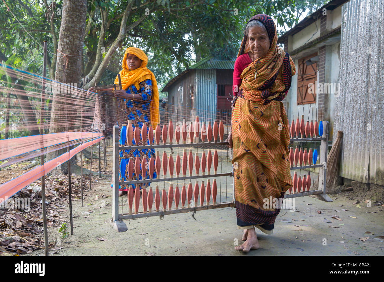 Bangladesh – December 18, 2017: An village old lady and other weaver ...