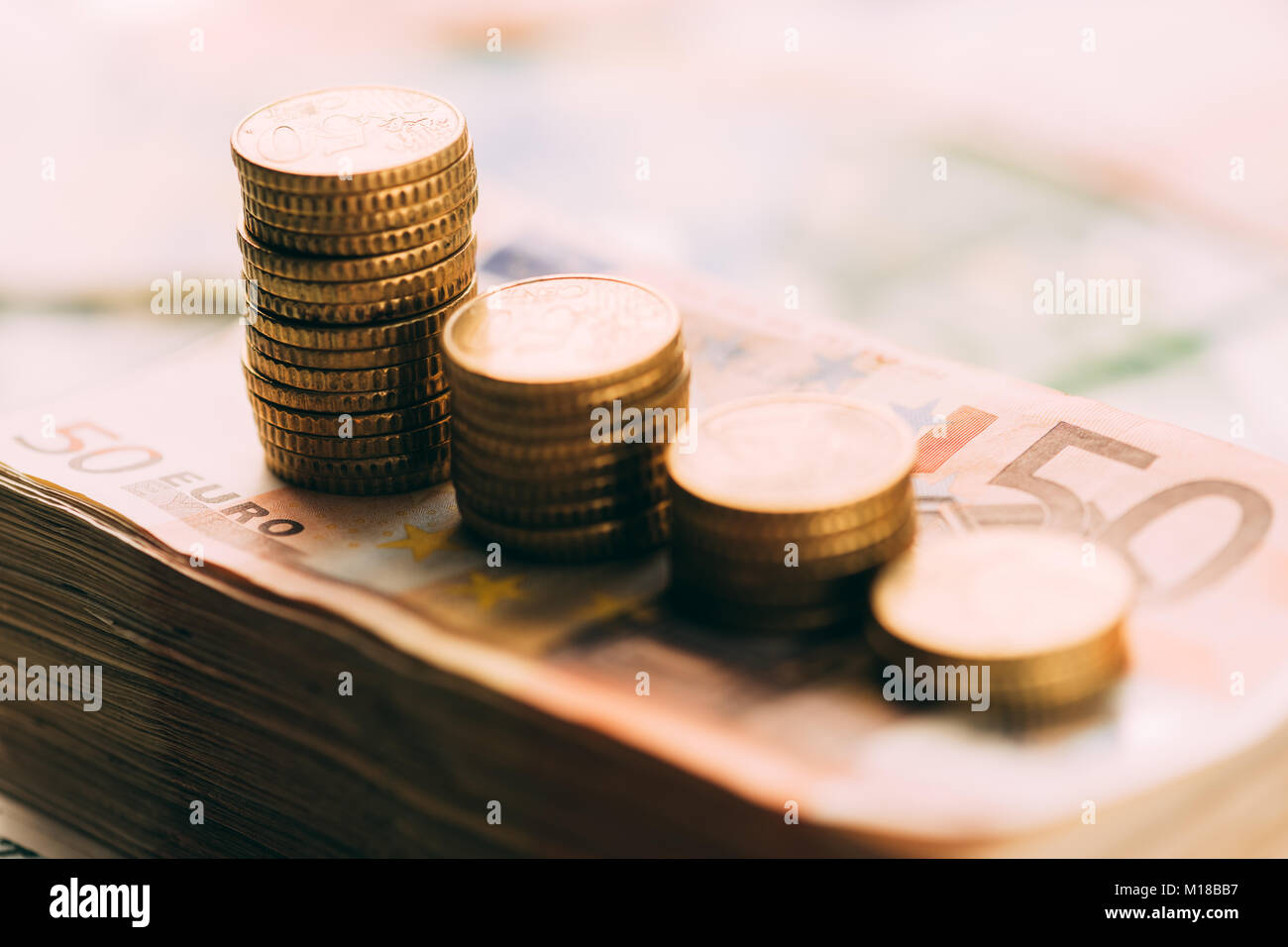 Euro coins on cash stack closeup Stock Photo