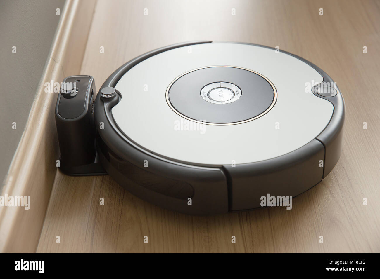 robot vacuum cleaner return to charging at dock in clean room floor