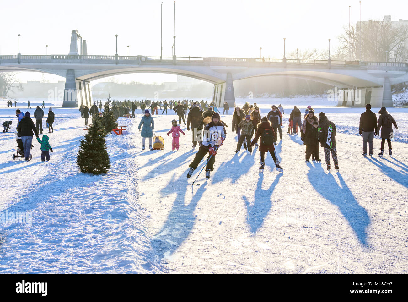 Ice skating on the Red River Mutual Trail, The Forks, Winnipeg, Manitoba, Canada. Stock Photo