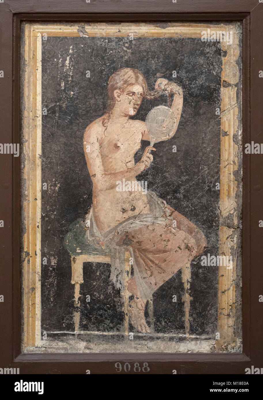 Naples. Italy. Portrait of a woman combing her hair, 1st century A.D. Museo Archeologico Nazionale di Napoli. Naples National Archaeological Museum.   Stock Photo