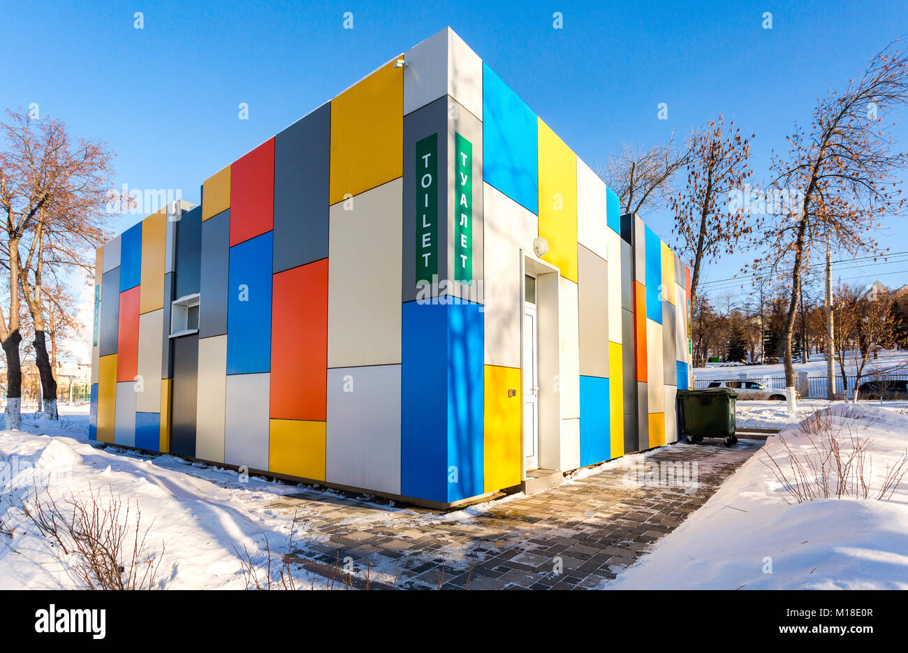 Samara, Russia - January 27, 2018: Vibrant colorful public toilet at the city embankment in winter sunny day. Text in russian: Toilet Stock Photo