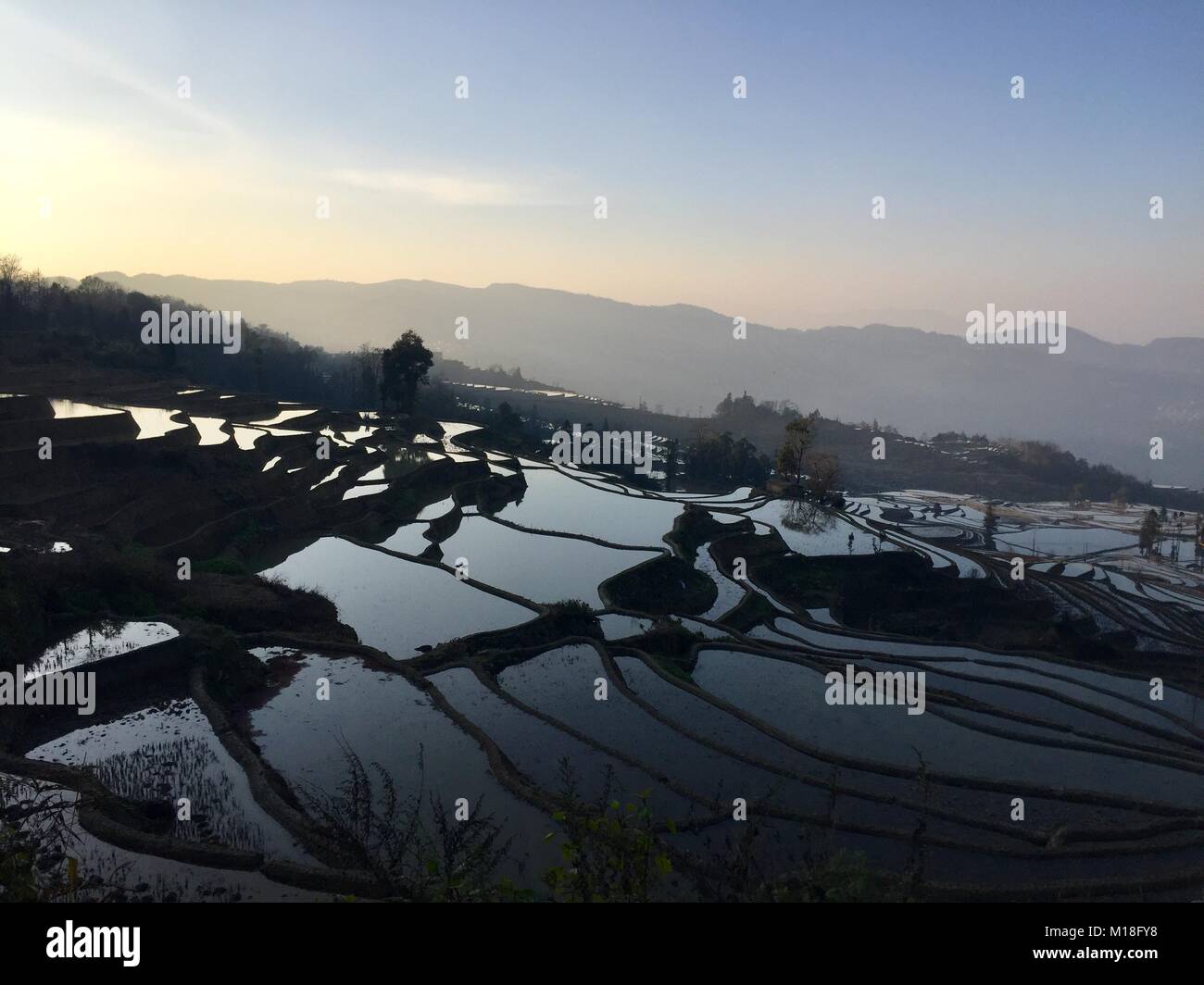 Panoramic view of Yuanyang rice terraces at the sunset (Yunnan, China) Stock Photo