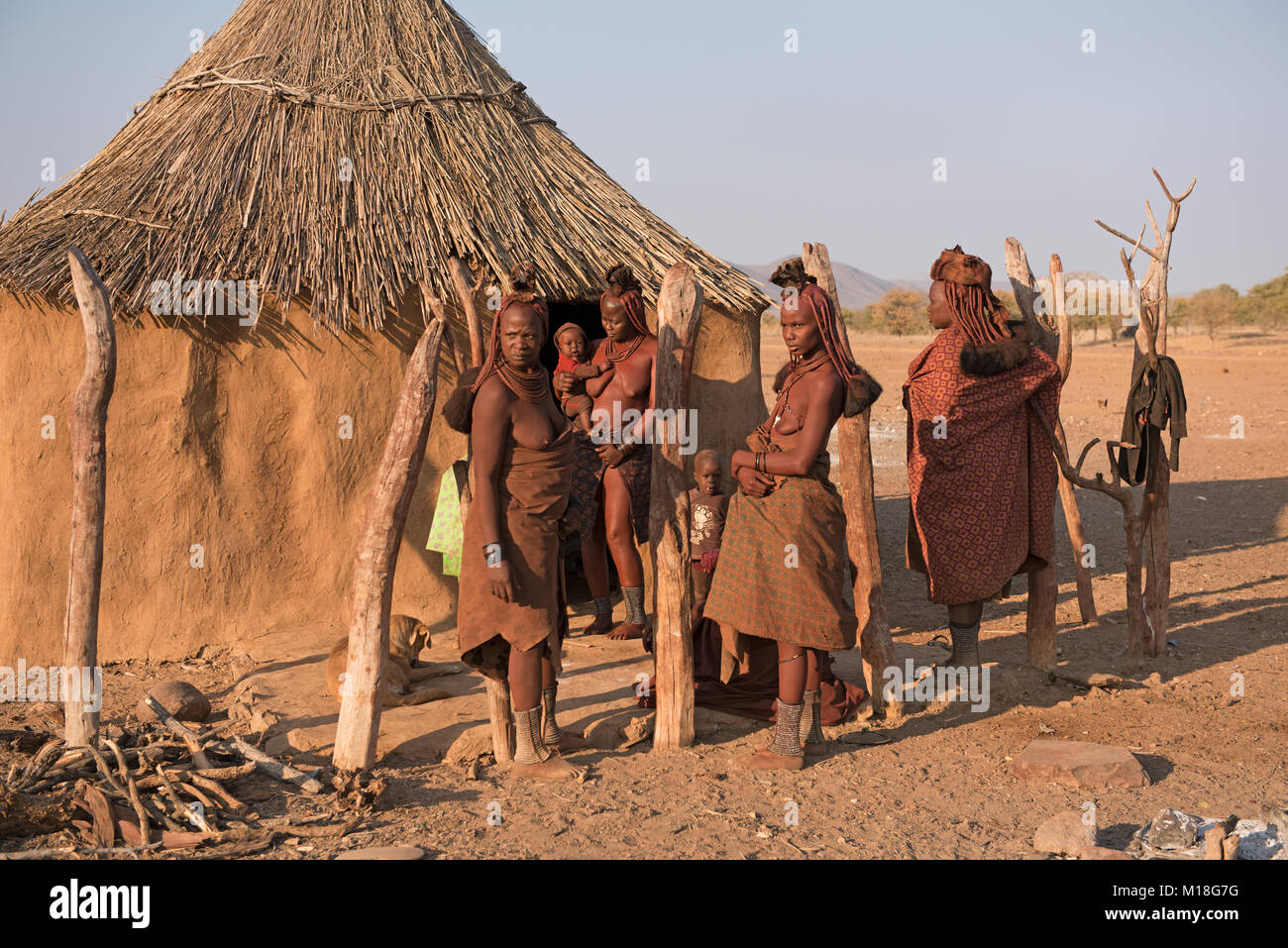 Himba women with small children in front of their hut,Kaokoveld,Namibia ...