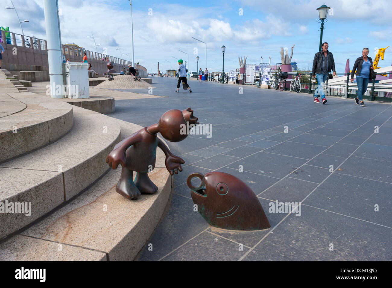 Princess & Magic Fish. Bronze sculpture by Tom Otterness. Fairytale Sculptures by the Sea