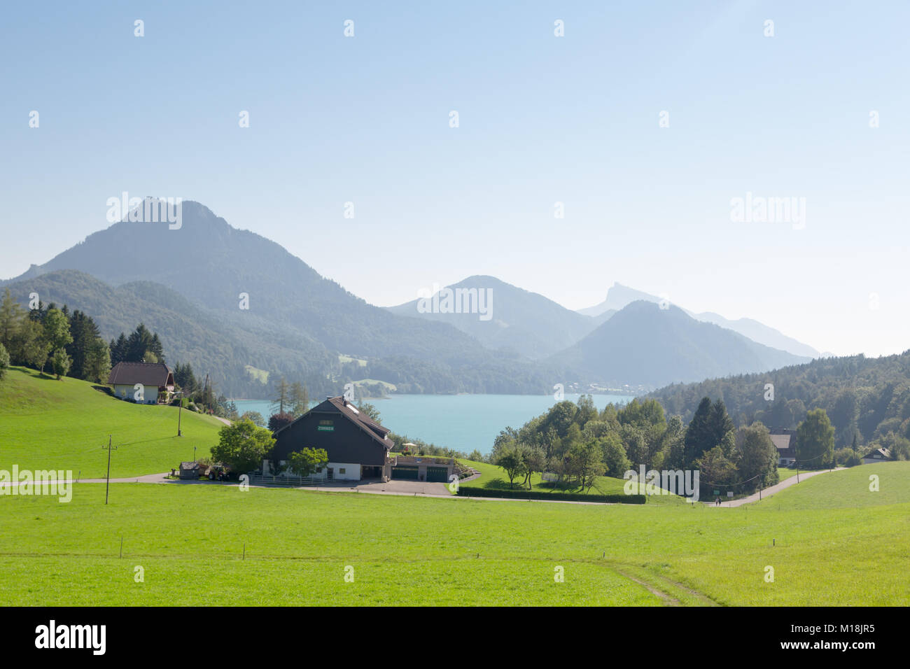 FUSCHL AM SEE, AUSTRIA - SEPTEMBER 14, 2016 : Landscape view of Lake Fuschlsee, Austrian Alpine mountains in touristic town of Salzburg Fuschl am See. Stock Photo