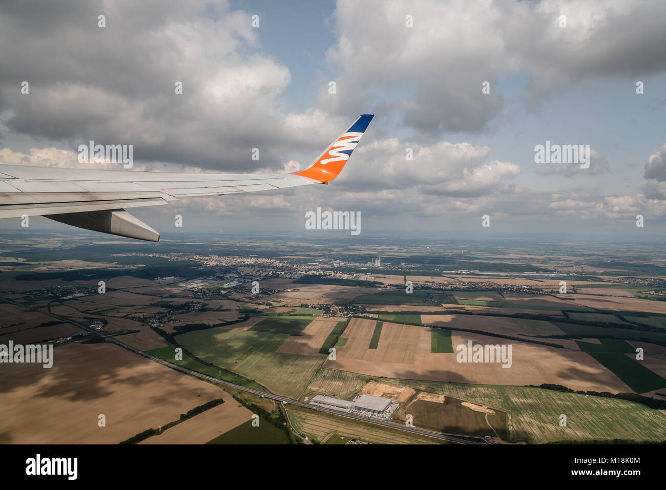 Prague, Czech Republic - August 22, 2017: Airplane wing of Czech airlines short after take off. Amazing view of aircraft wing in altitude during fligh Stock Photo