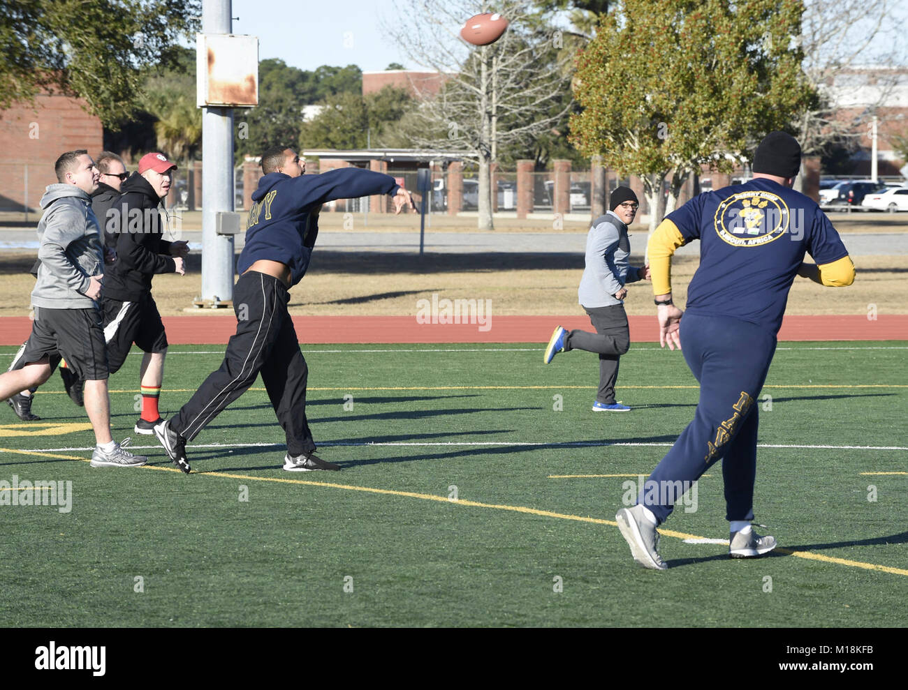 Fla. (Jan. 25, 2018) Center for Information Warfare Training (CIWT) staff participate in an Ultimate Football physical fitness session on board Naval Air Station Pensacola Corry Station, Florida. CIWT staff takes physical fitness seriously and regularly trains together to strengthen teamwork and maintain readiness. (U.S. Navy Stock Photo